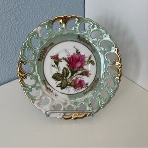Pink and Gold Decorative Plate with Elegant Accents